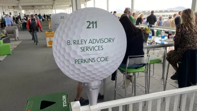 a large white sign with green text