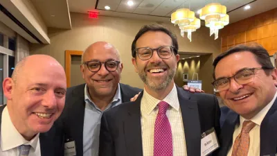 a group of men smiling
