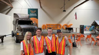 a group of people wearing safety vests posing for the camera