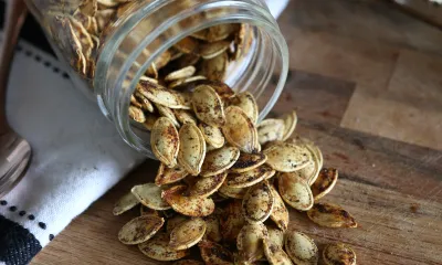 a knife sitting on top of a wooden cutting board