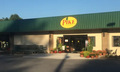 a sign in front of a building