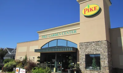 a small clock tower in front of a building