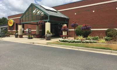 an empty road in front of a house