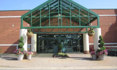 a group of people standing in front of a building