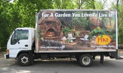 a delivery truck with a sign on it