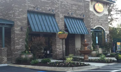 a close up of a street in front of a brick building