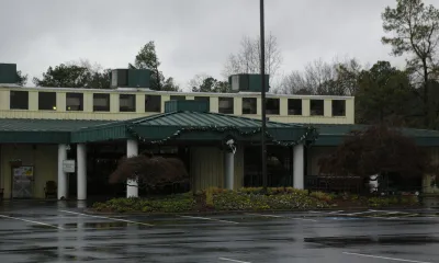 a house in the middle of the street
