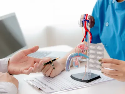 a person holding a stethoscope over a patient's shoulder