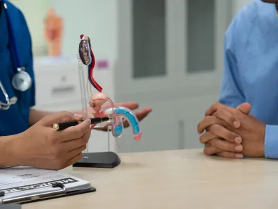 a person holding a stethoscope over a person's head