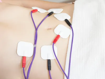 a group of headphones on a bed