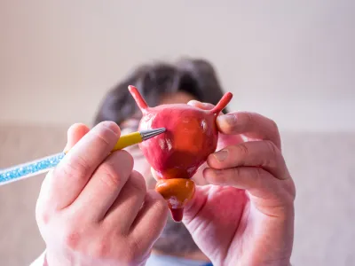 a person painting a red apple