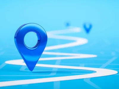 Blue location markers on a light blue digital map with a winding white route line showing navigation path.