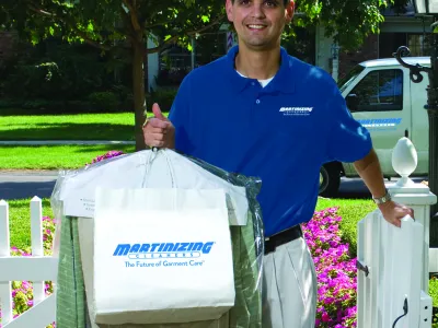 a man holding a white bucket