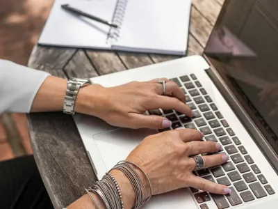 a person typing on a laptop