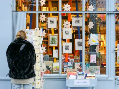 a person looking at a display of books