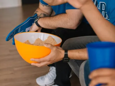 a person holding a bowl of food