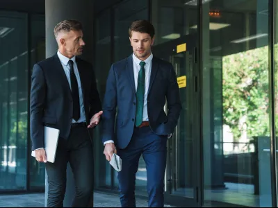 a couple of men in suits