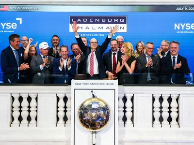 Group of professionals celebrating at the New York Stock Exchange closing bell ceremony on July 9, 2026.
