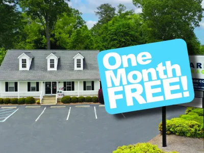 a sign in front of a house