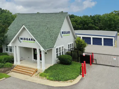 Midgard Self Storage facility with gated access and multiple storage units on a sunny day.
