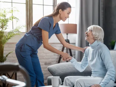 a person pushing a person in a wheelchair