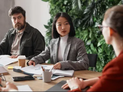 a group of people sitting around a table