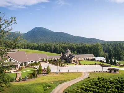 a house with a mountain in the background