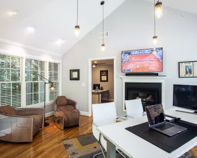 a living room filled with furniture and a flat screen tv