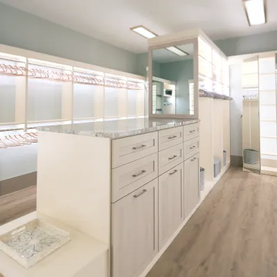 a large kitchen with white cabinets