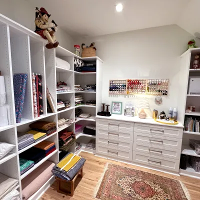 a room with shelves and a chair