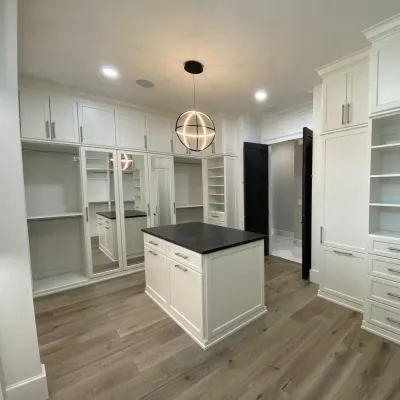 a kitchen with white cabinets