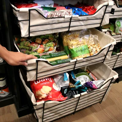 a person pushing a shopping cart full of food