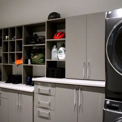 a laundry room with custom storage