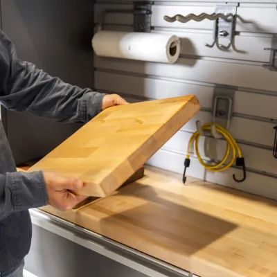 a man holding a wooden board