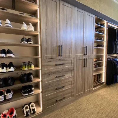 a closet with shoes and shoes