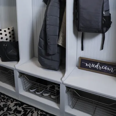 a closet with a coat rack and a coat rack