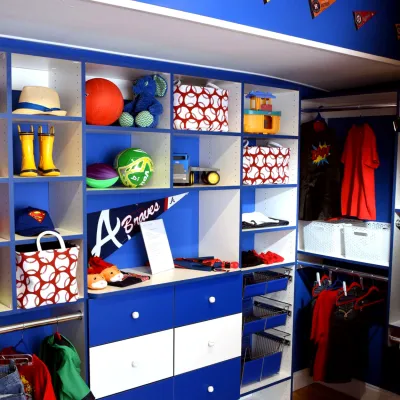 a blue shelving unit with a variety of objects on it