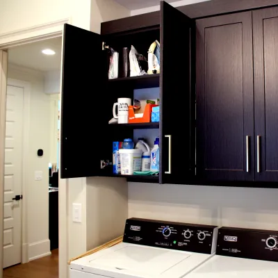 a kitchen with black cabinets