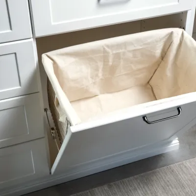 a white rectangular box with a white lid on a tile floor