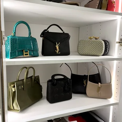 a shelf with purses on it