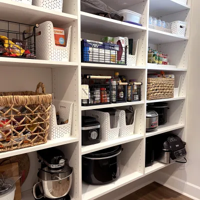 a white shelving unit with various items on it