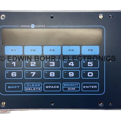 General Electric numeric keypad with function keys and LCD display panel in dark casing