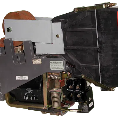 Industrial electrical switchgear component with high voltage danger warning label and metal springs.