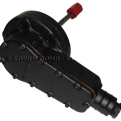 Black mechanical component with multiple bolts and a red capped rod extending from it, isolated on white.