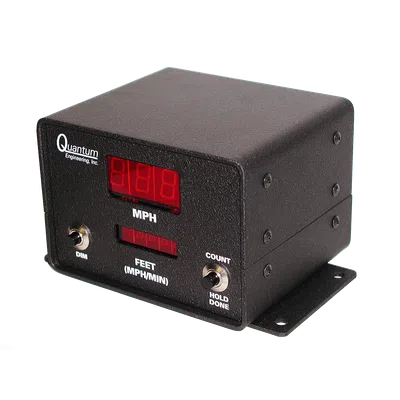 Black Quantum Engineering speed measurement device with digital red LED displays and toggle switches on a metal base.