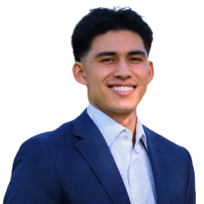 a man in a suit smiling