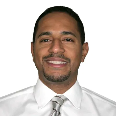 Jean Rocourt wearing a white shirt and a tie