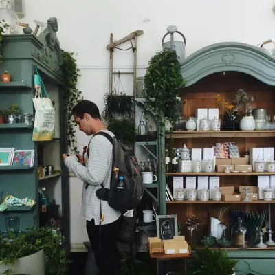 a man standing in front of a store