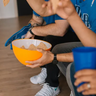 a person holding a bowl of food