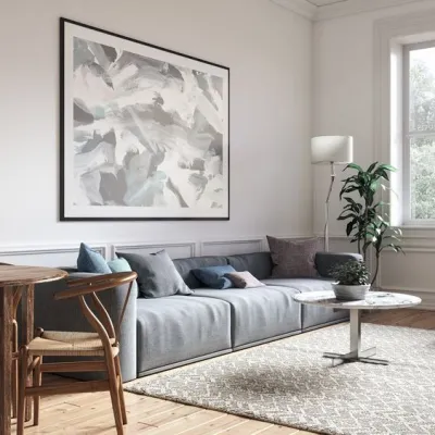 a living room with a couch and chairs